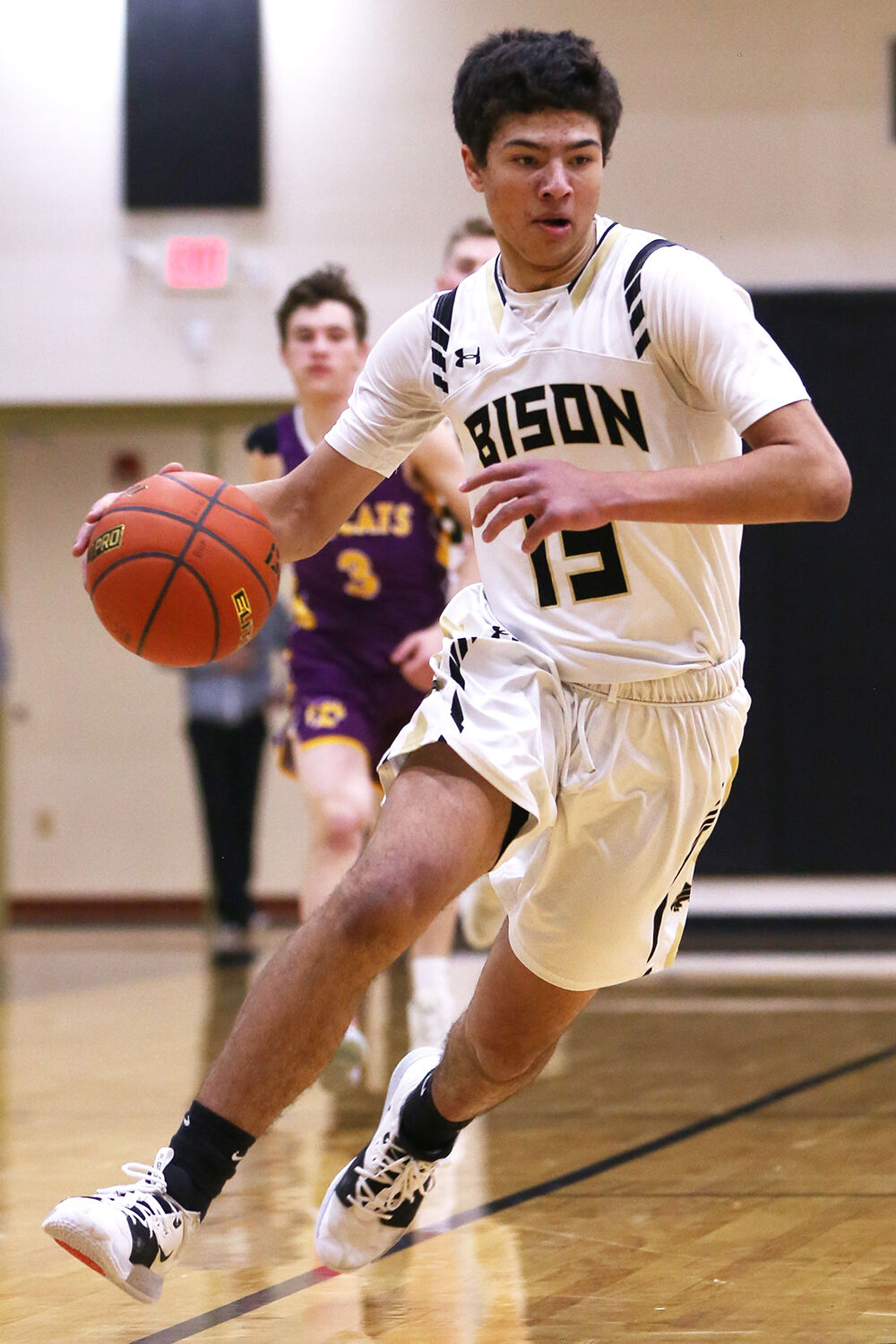 Eli Patterson rushes down court in a breakaway run to the basket